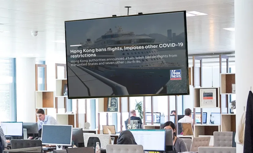 Digital signage screen hung on office working area showing Fox news feeds from Pickcel digital signage software