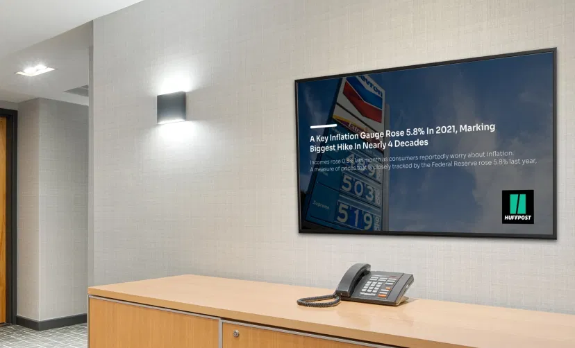 Digital signage screen showing HuffPost news feeds at various locations