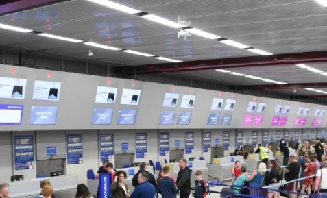 Digital signage at airport displaying weather updates to help airlines and passengers