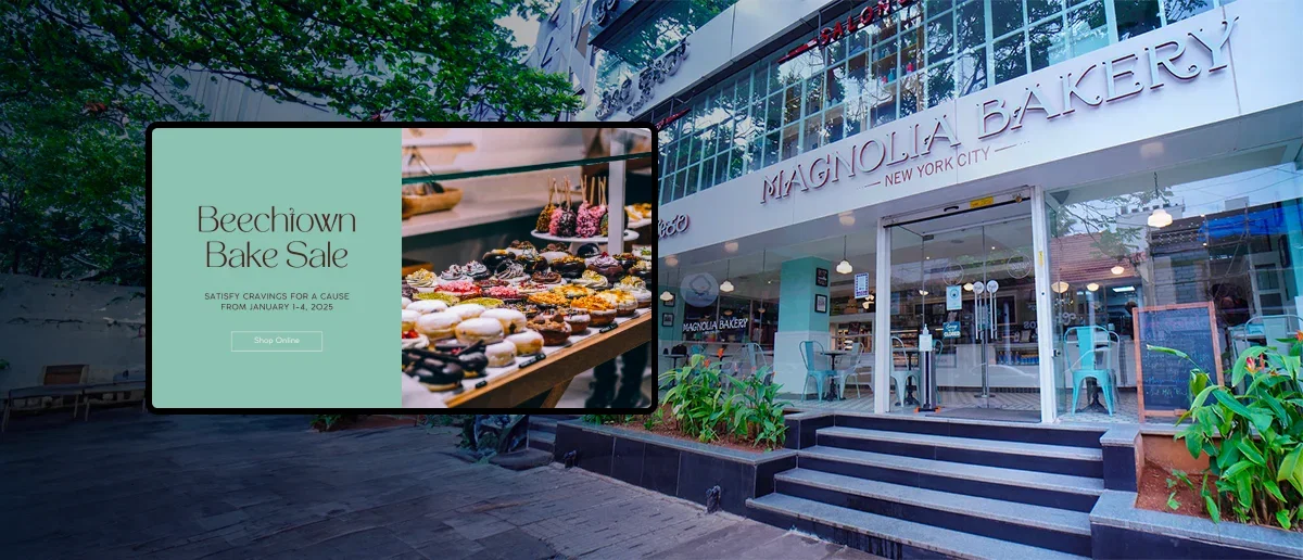 Magnolia Bakery storefront showing digital screens managed by Pickcel digital signage software
